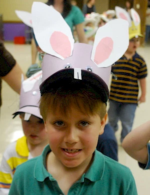 young boy wearing a homemade hat with bunny ears